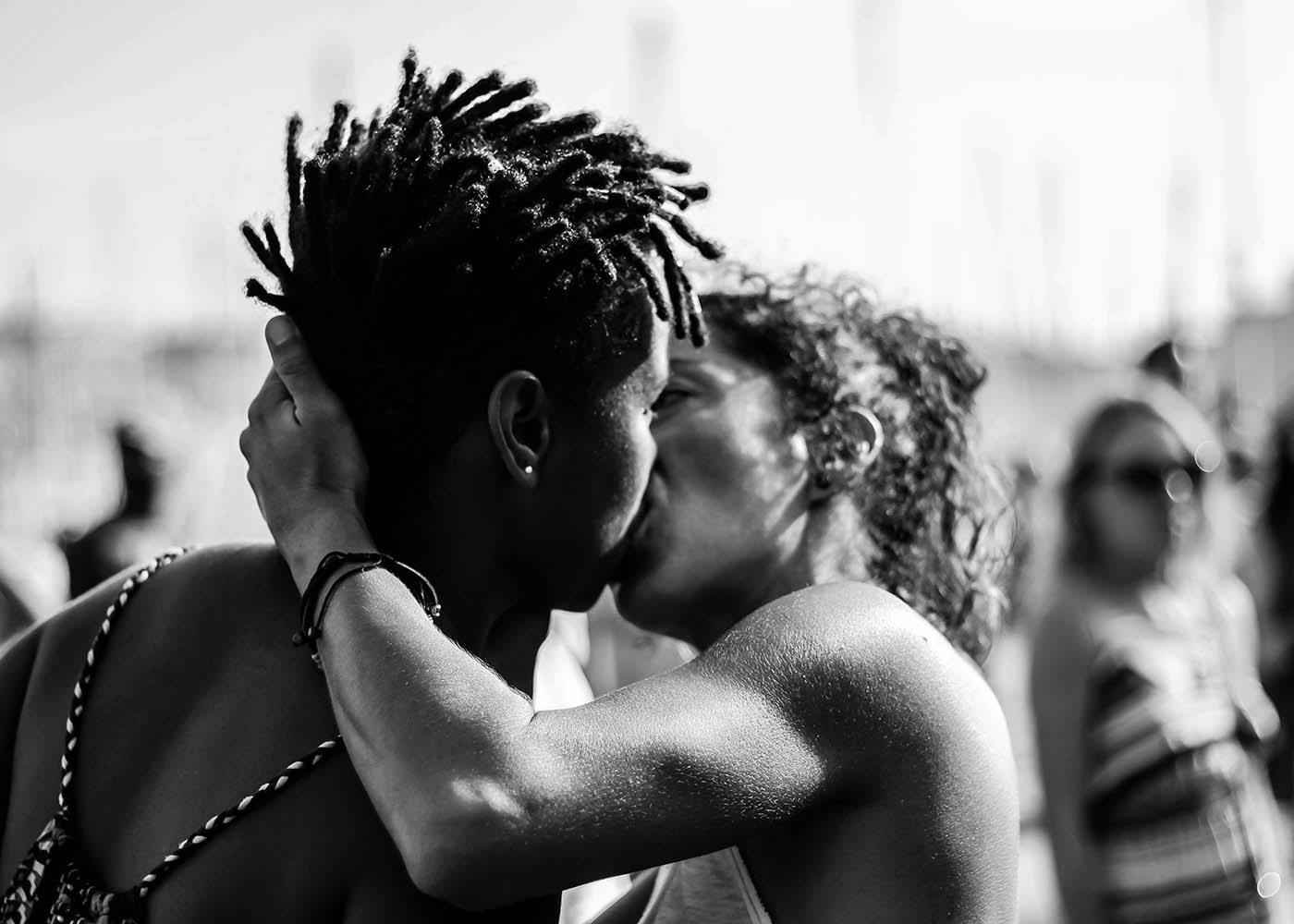 Couple kissing outside during a protest