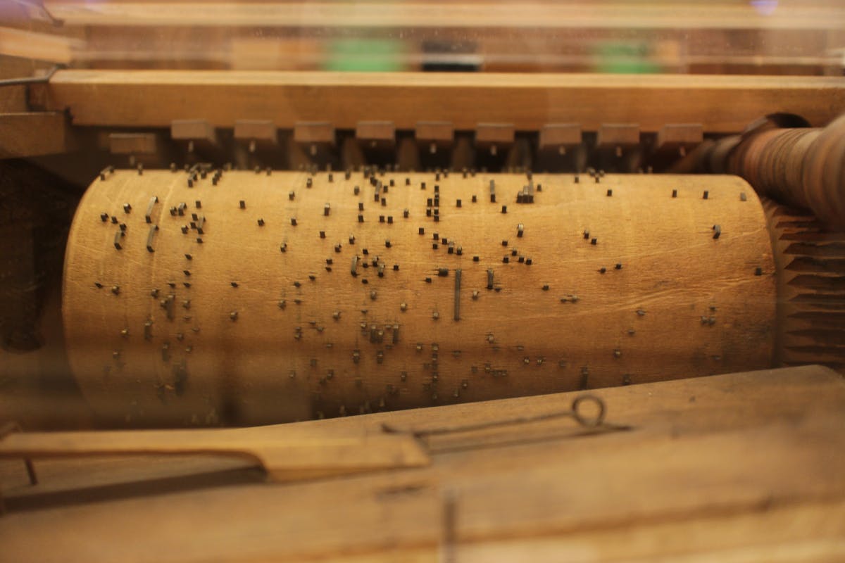 Image of a old time player piano wooden roller.