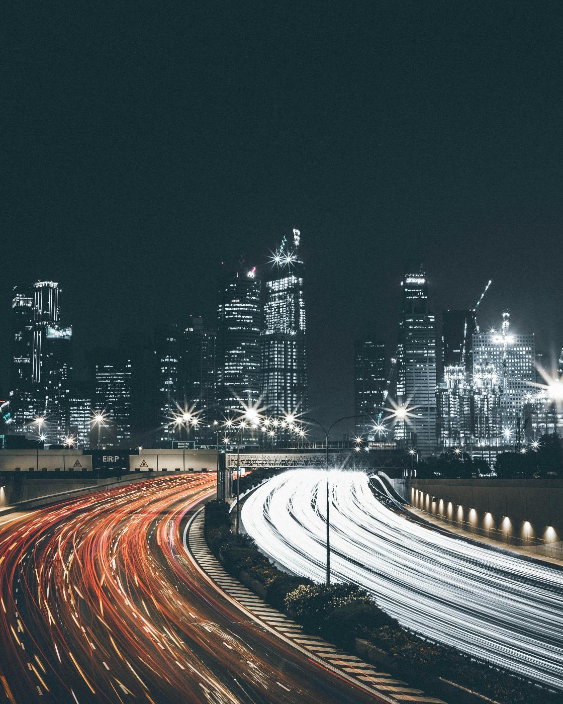 A highway at night with streaks of light from cars