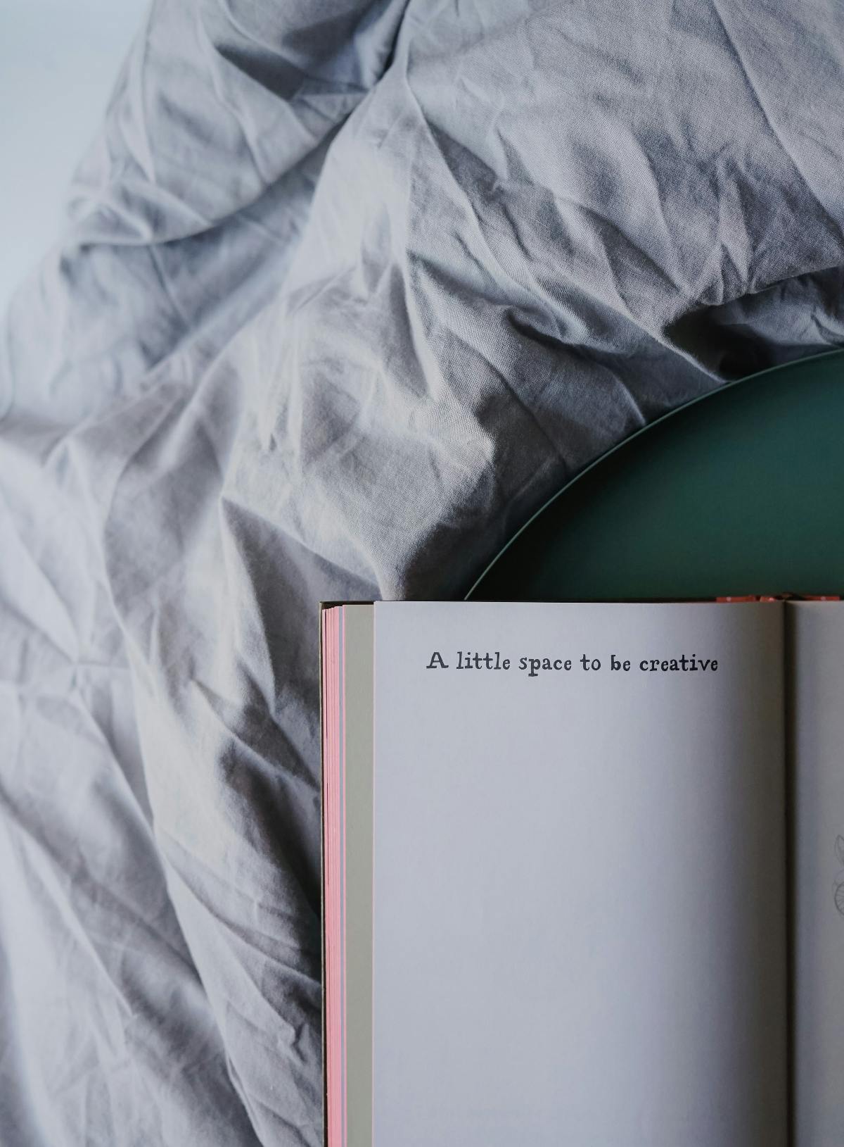 an open journal with the words "a littile space to be creative"
