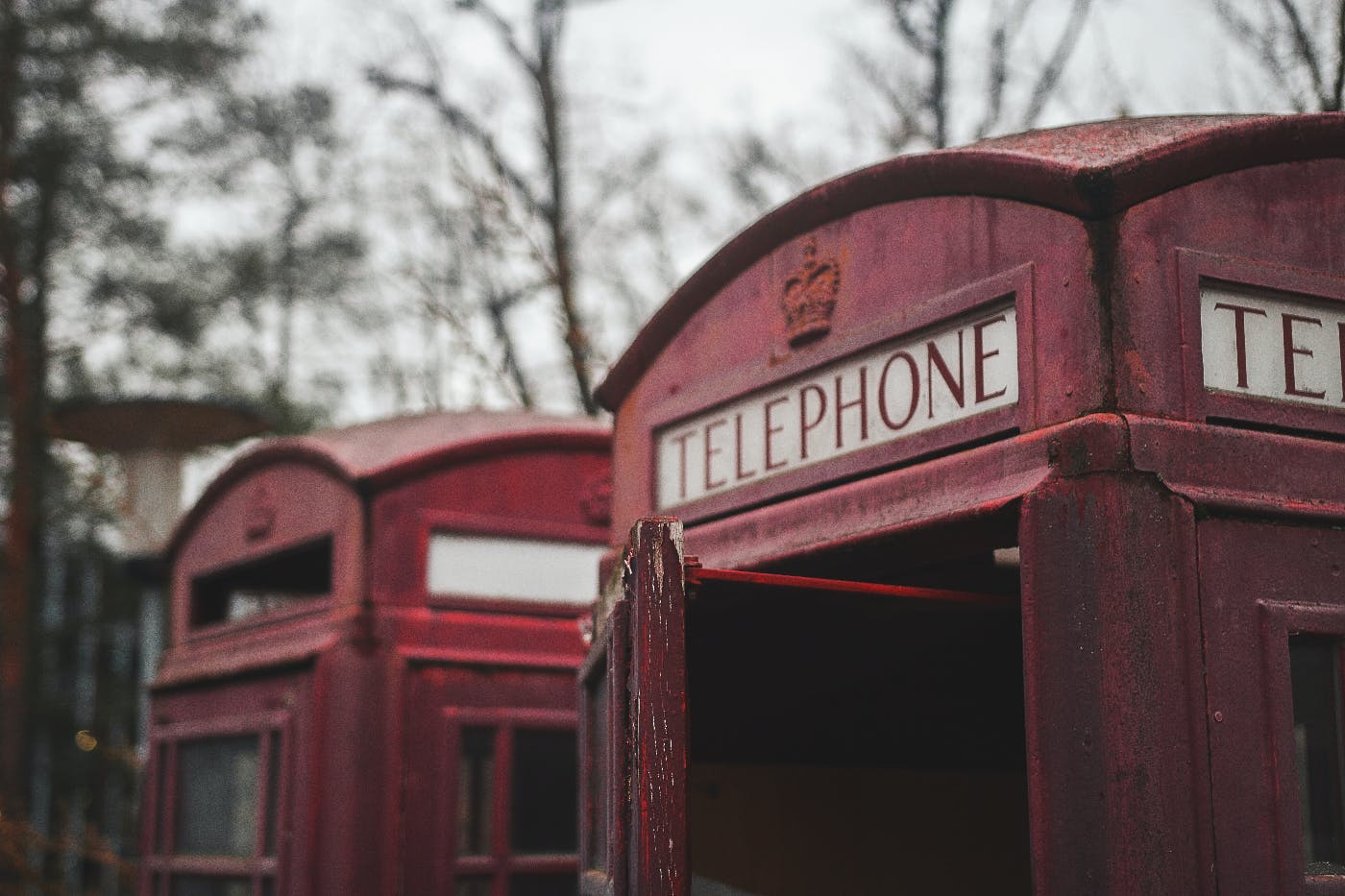 The tops of two red British phone boxes