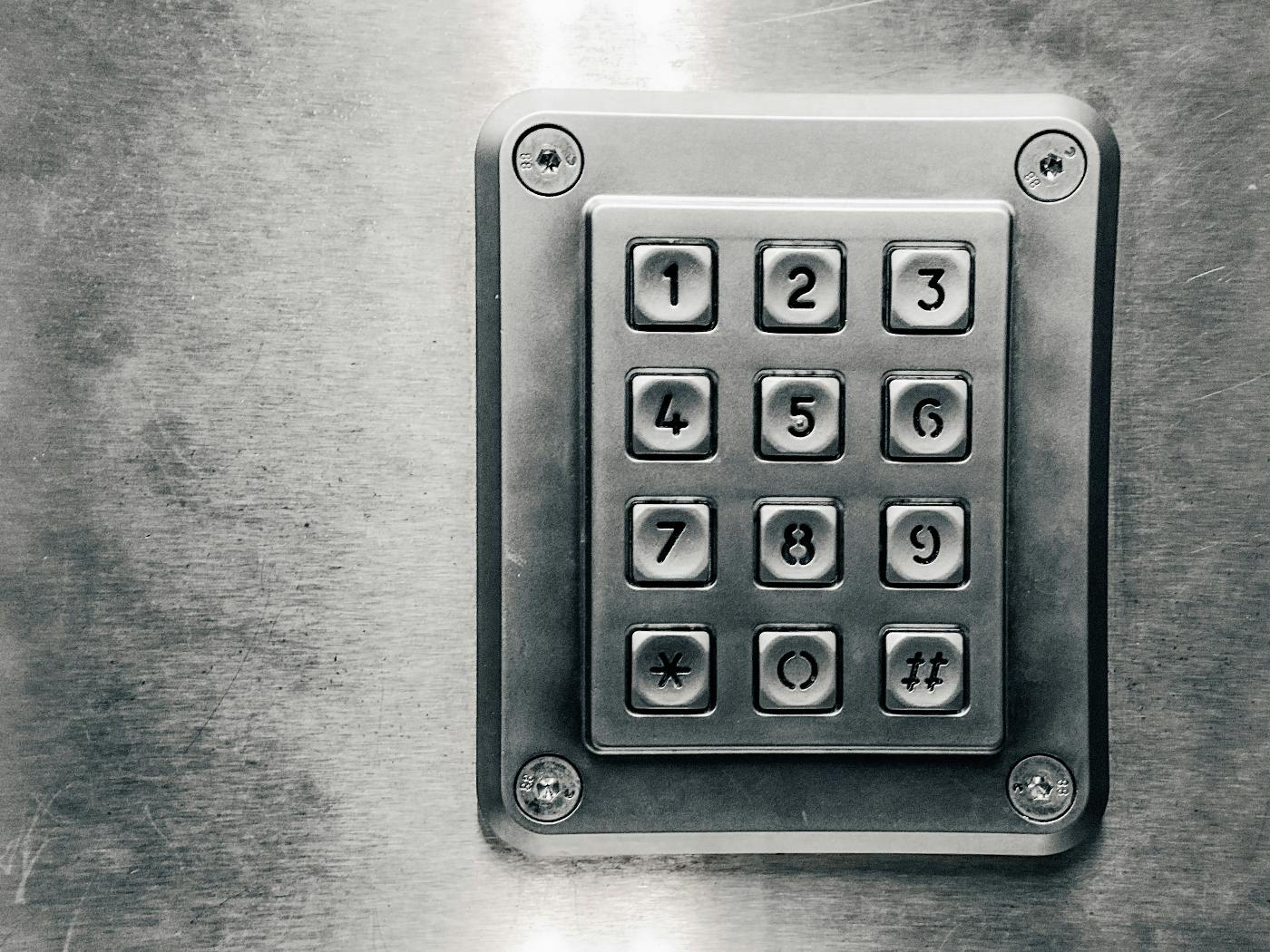 a steel keypad on a wall