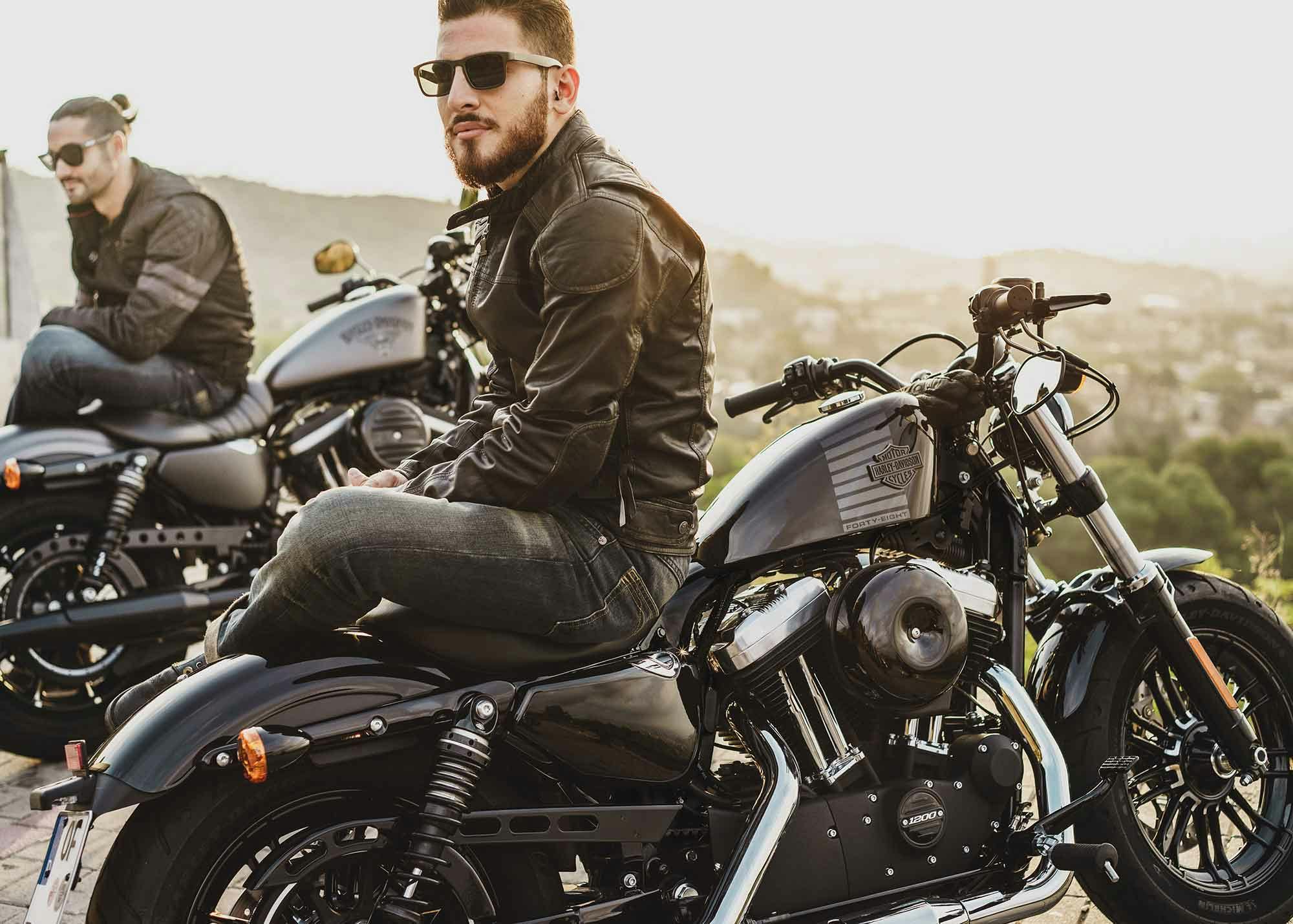 Men sitting on Harley bikes