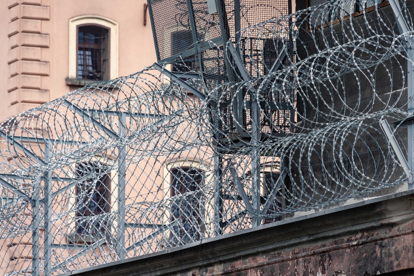 a razor wire fence over a wall