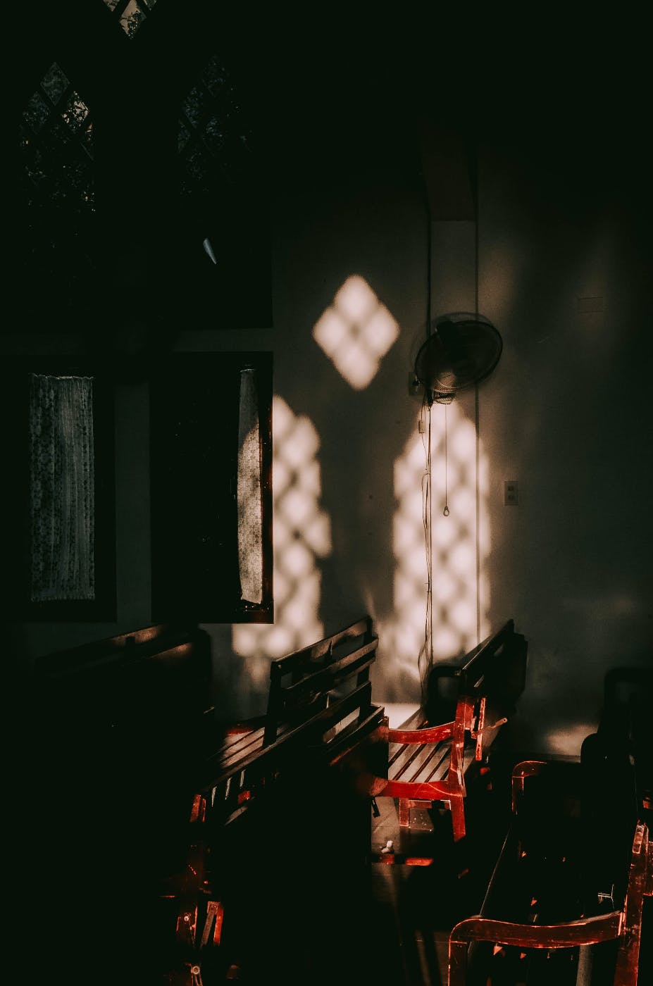 Shadowed walls inside a dark chapel
