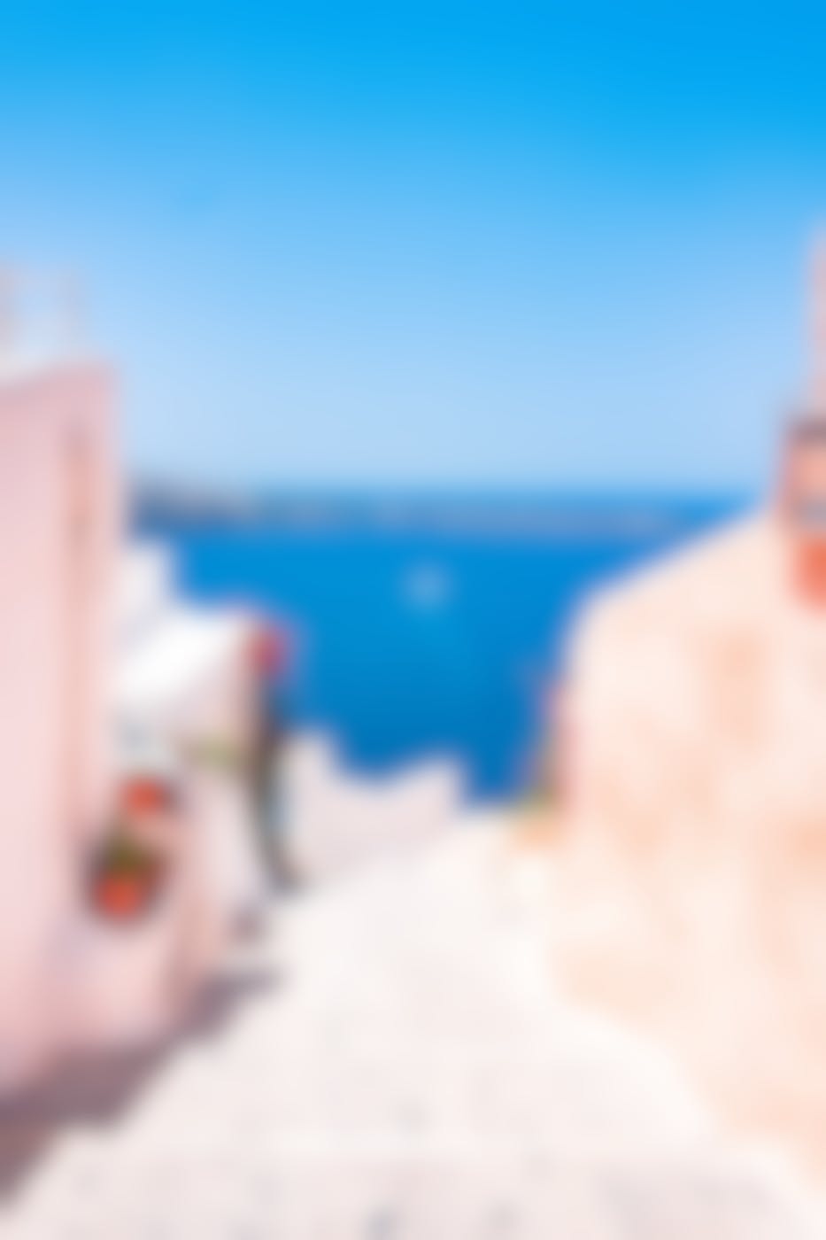 White stucco buildings overlooking an azure sea