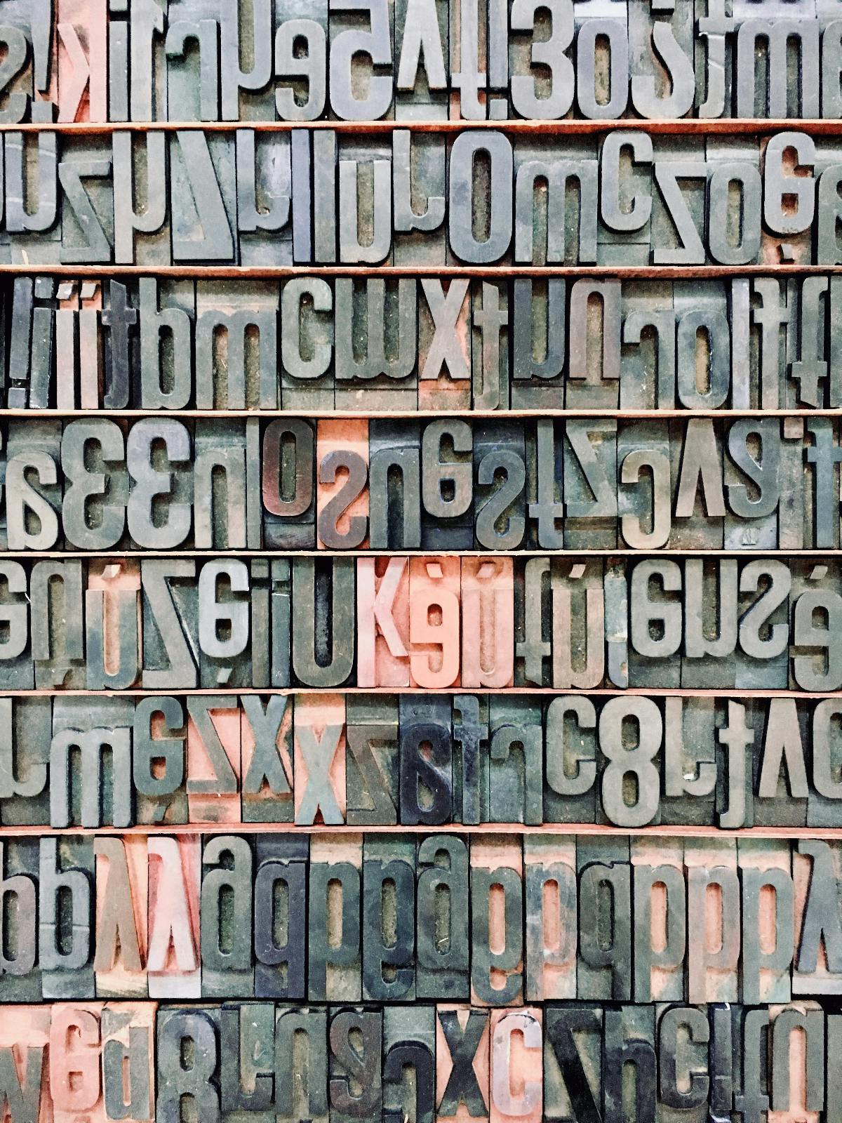 a wall of moveable type from an old fashioned printing press