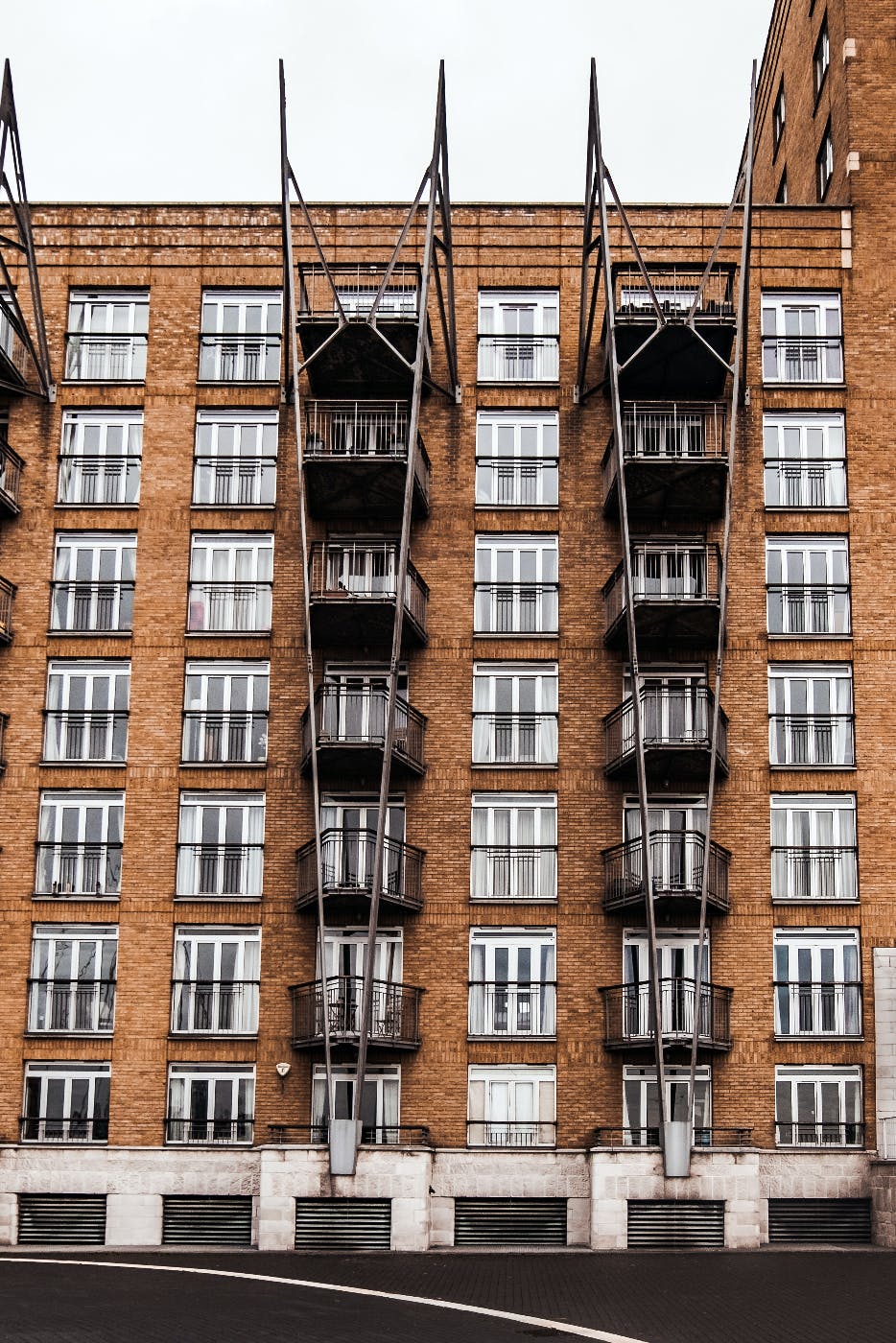 An apartment builidng with two identical sets of balconies