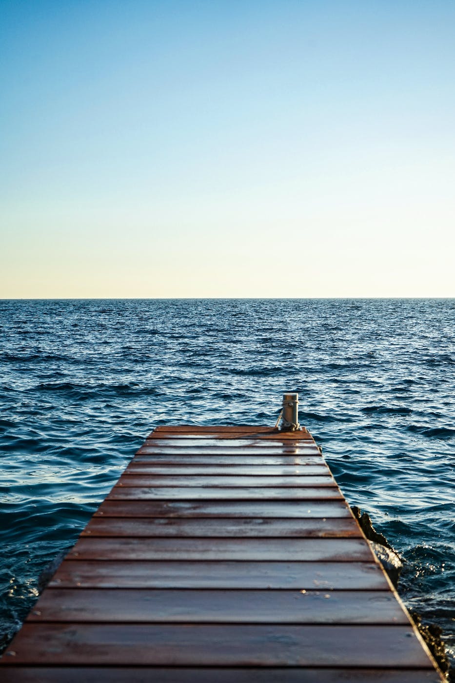 a dock stretching into open water