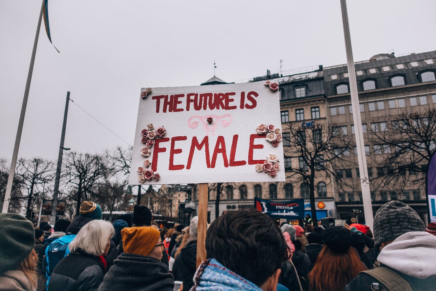 A women's match and sign reading The Future is Female