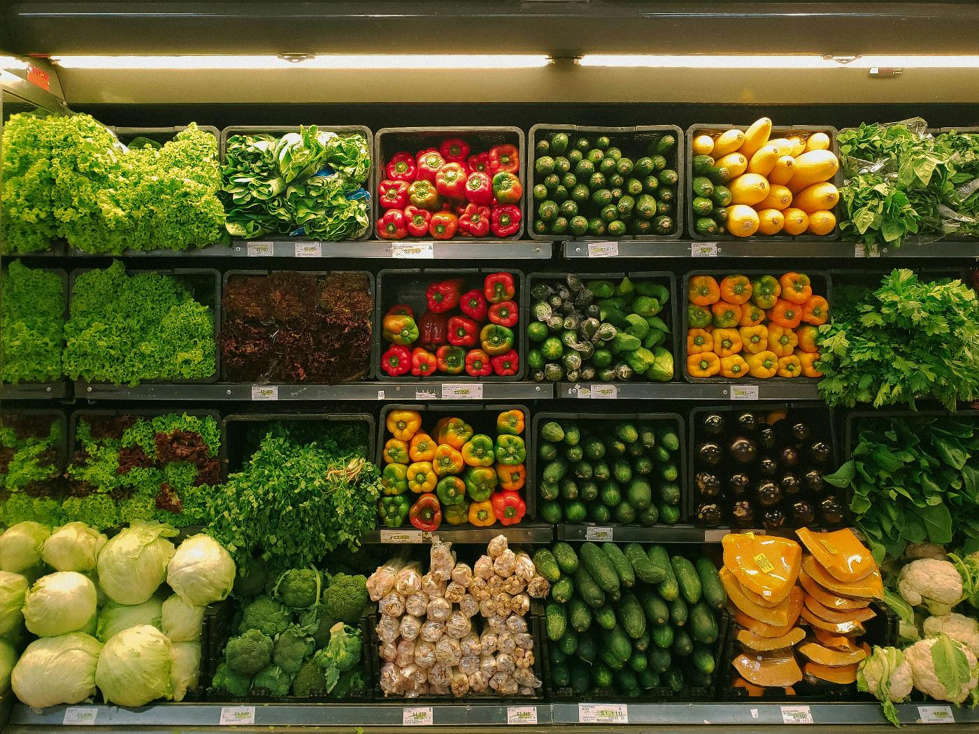 Shelves of milk crates filled with organic vegetables