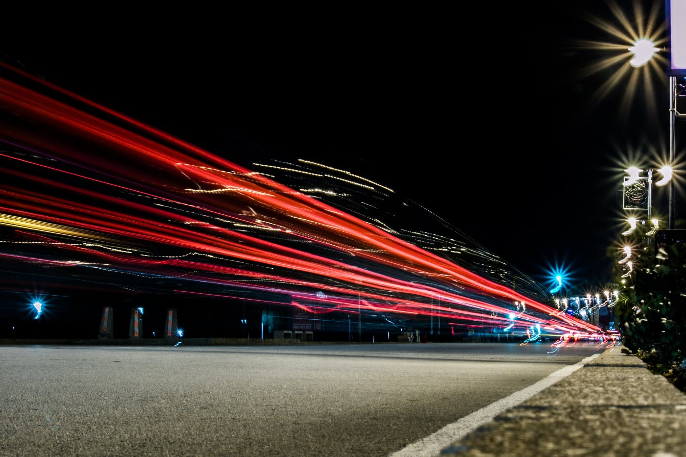 Cars appear as streaks of light in this night time photo of a highway