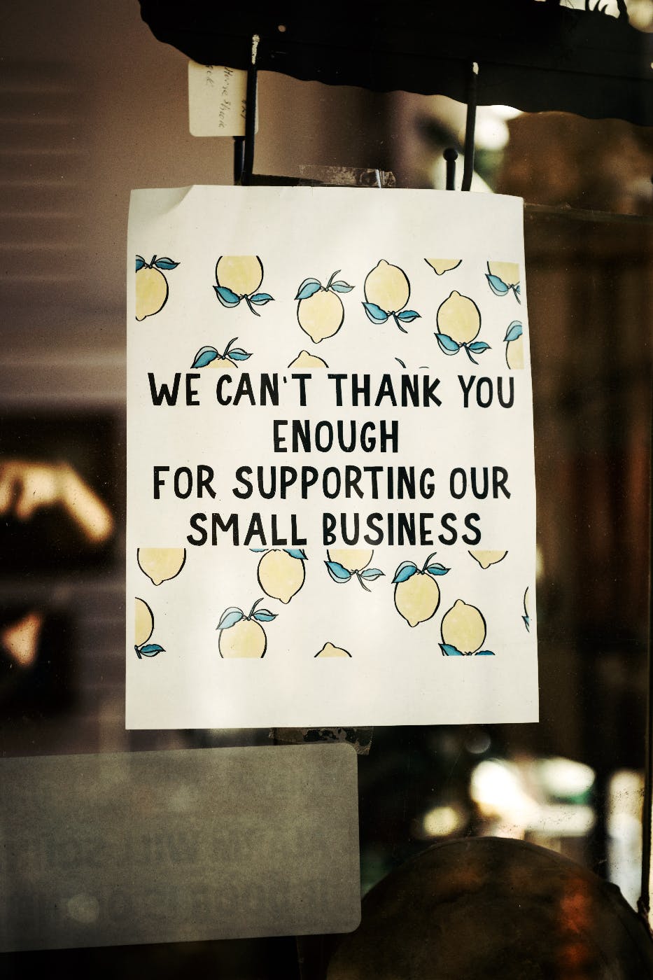 A sign reading we can't thank you enough for supporting our small business
