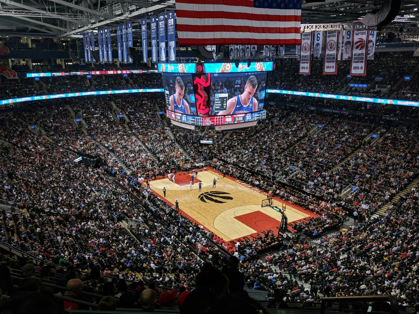 crowd at the Scotiabank Arena watching the Raptors play basketball