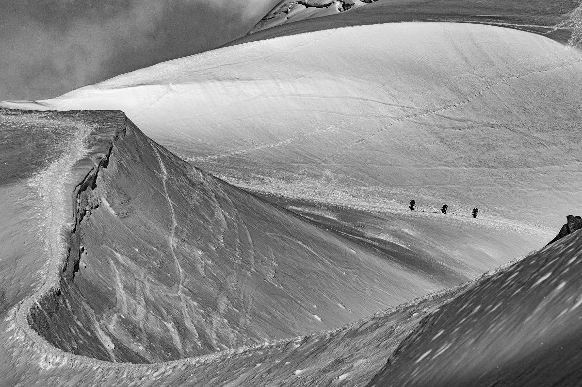 snow peaker mountains and three travelers on their journey