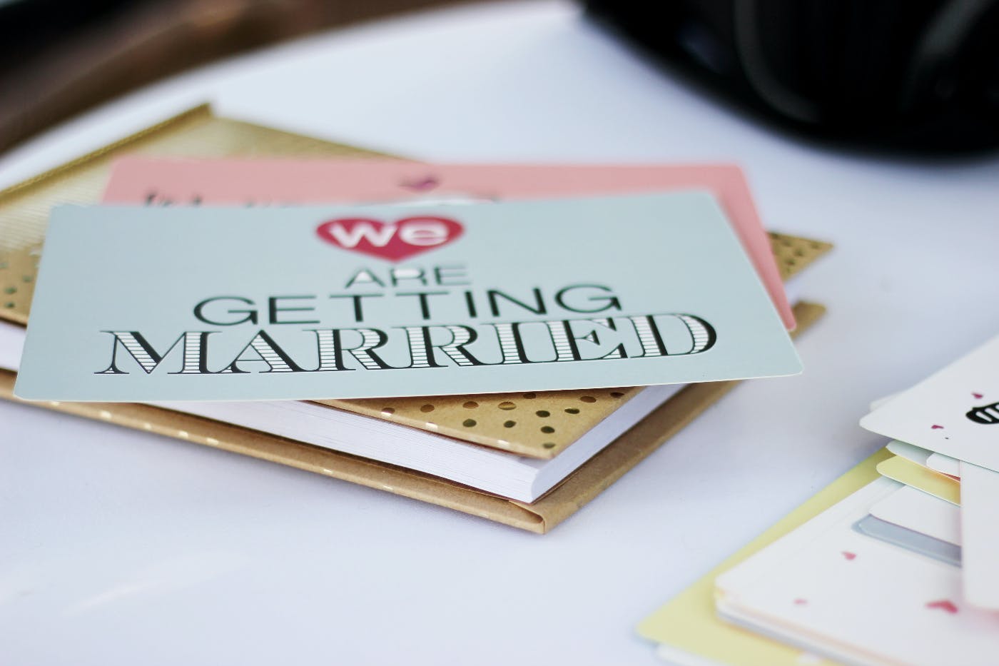 A wedding invitation with We are getting married on it