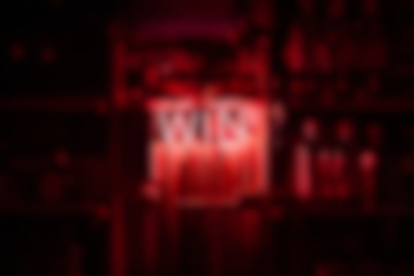 A dark bar with the word WIN lit up in red neon