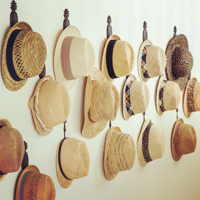 hats hanging on wall