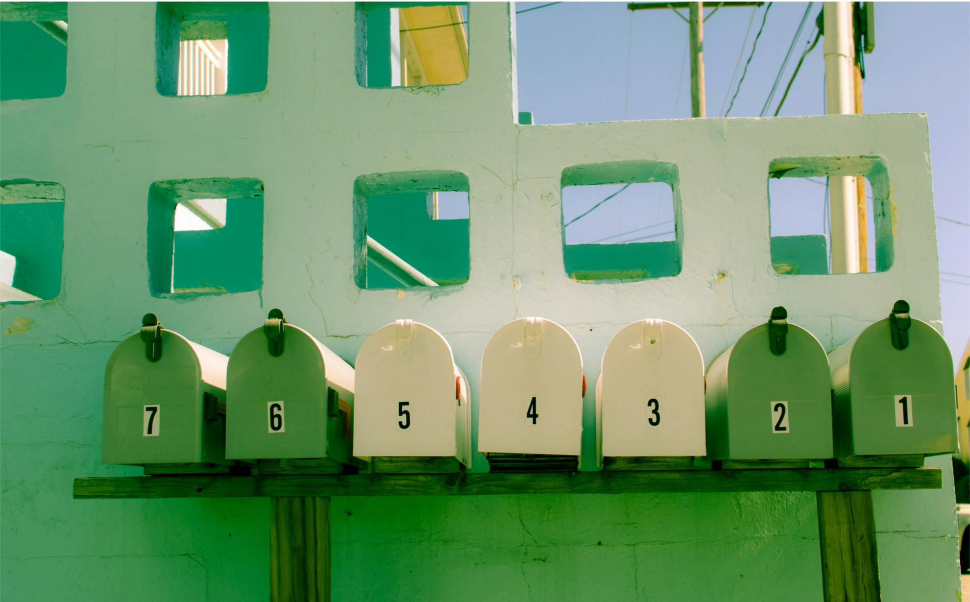 green row of mailboxes