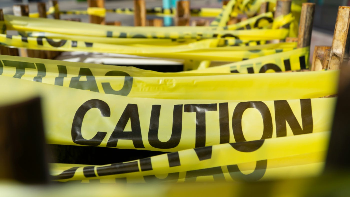 Caution tape wrapped around poles