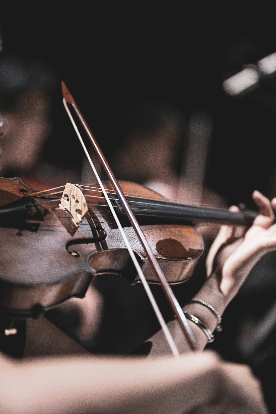 a violin being played by a woman