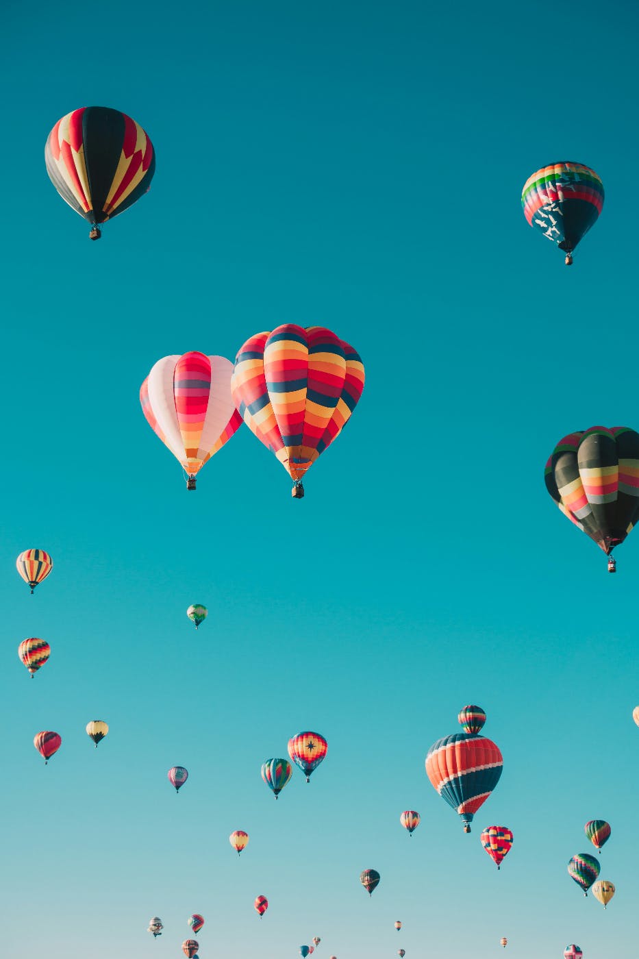 Dozens of colorful hot air baloons