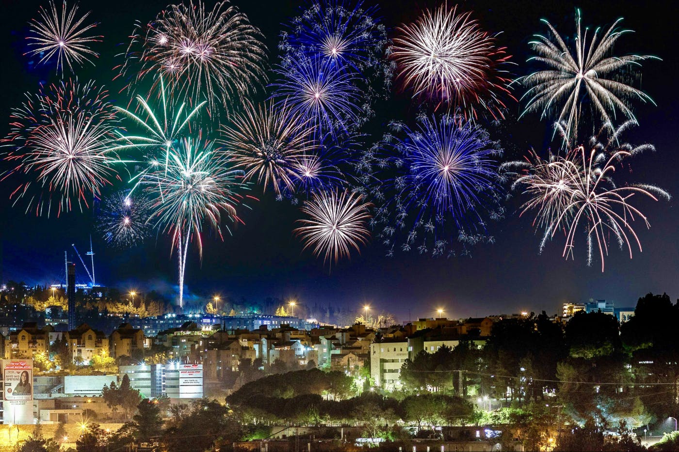 Fireworks over a city at night