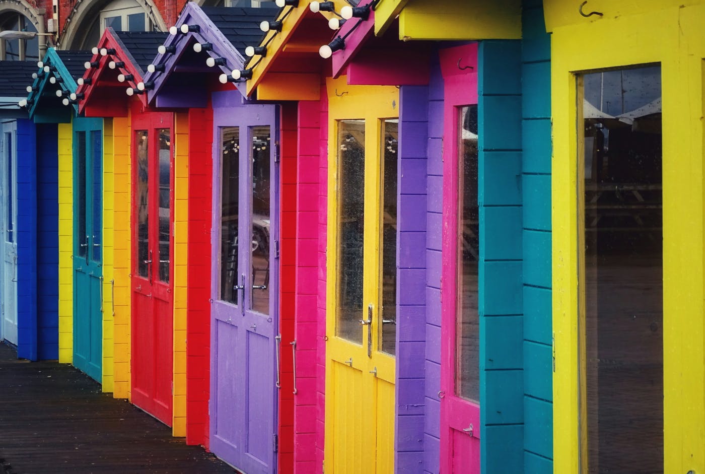 A row of brightly colored bungalows