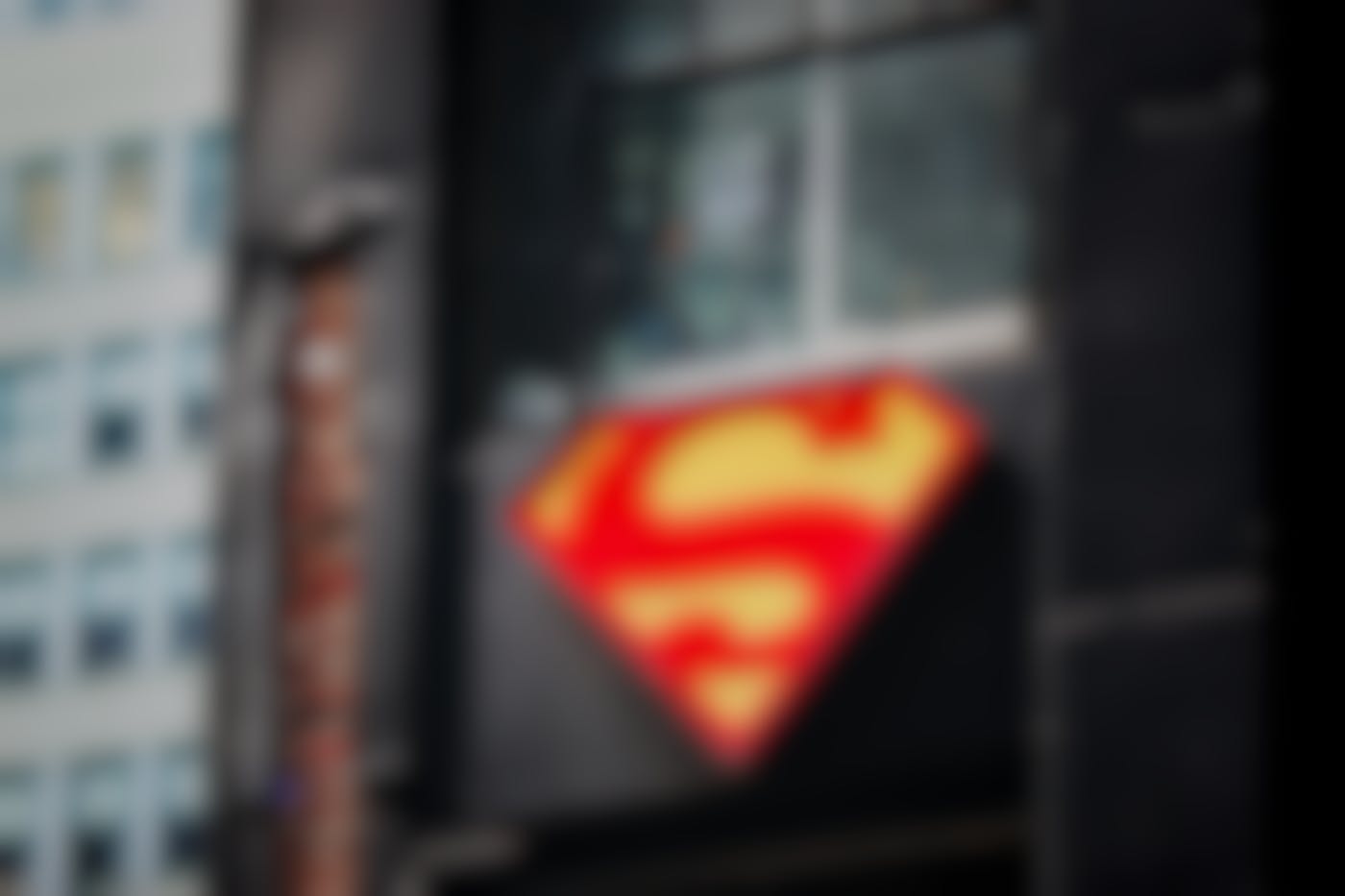 The Superman symbol on the side of a beat up building