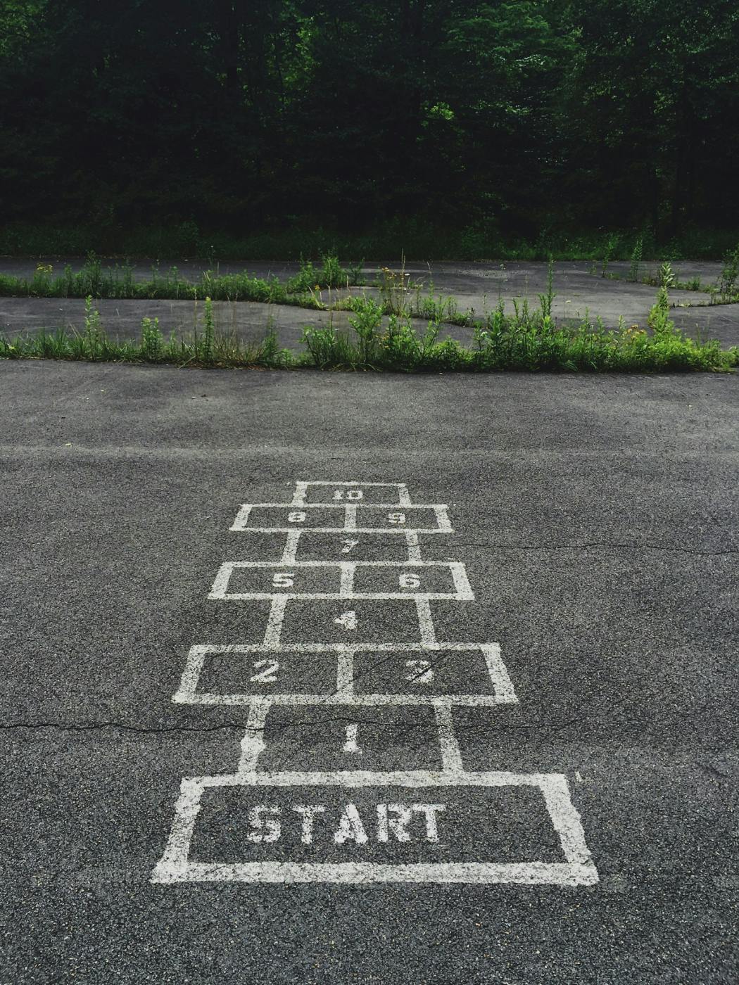 A hopscotch board in a parking lot