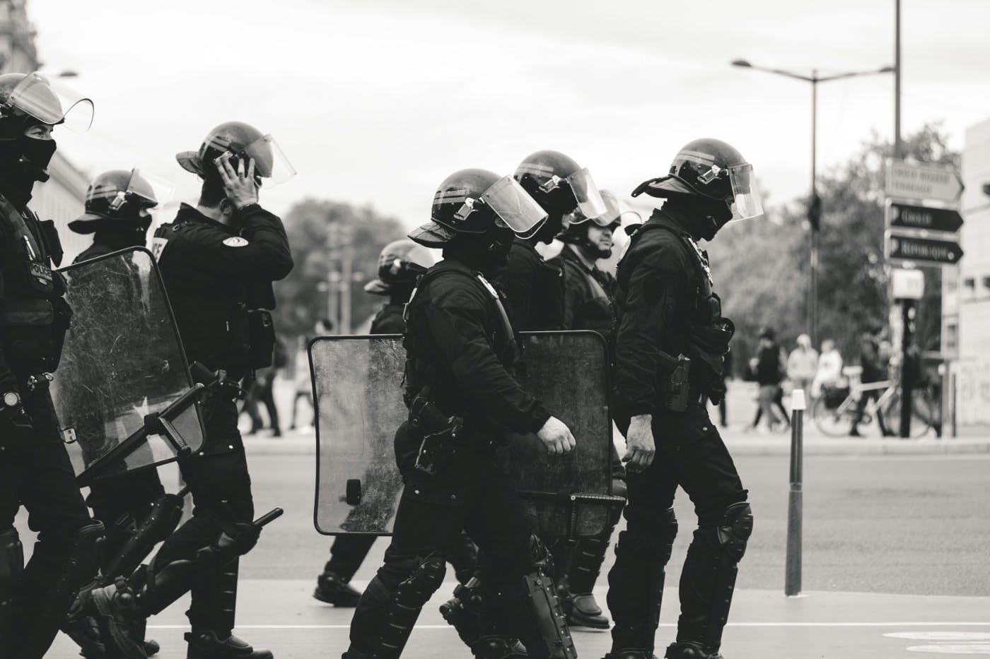 Black and white image of police in riot gear