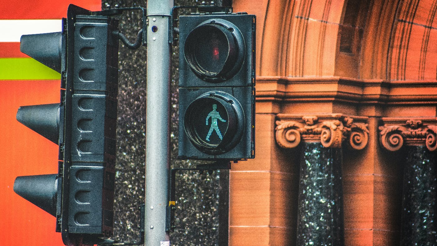a traffic light showing a walk signal