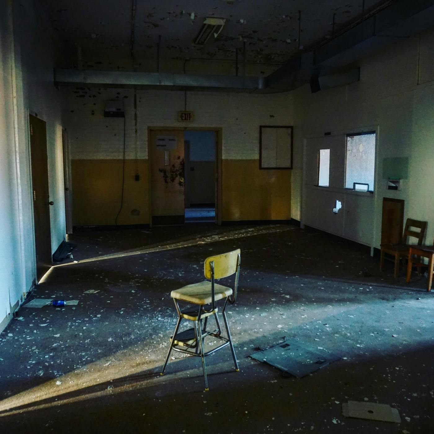 a single chair in an abandoned office room