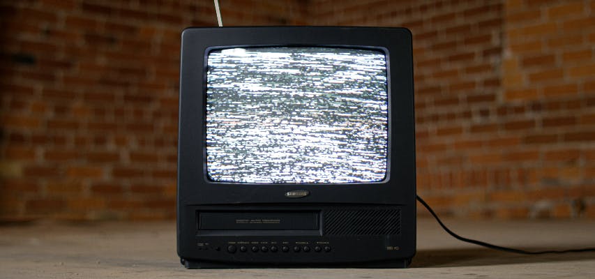 An old Samsung TV with static on the screen