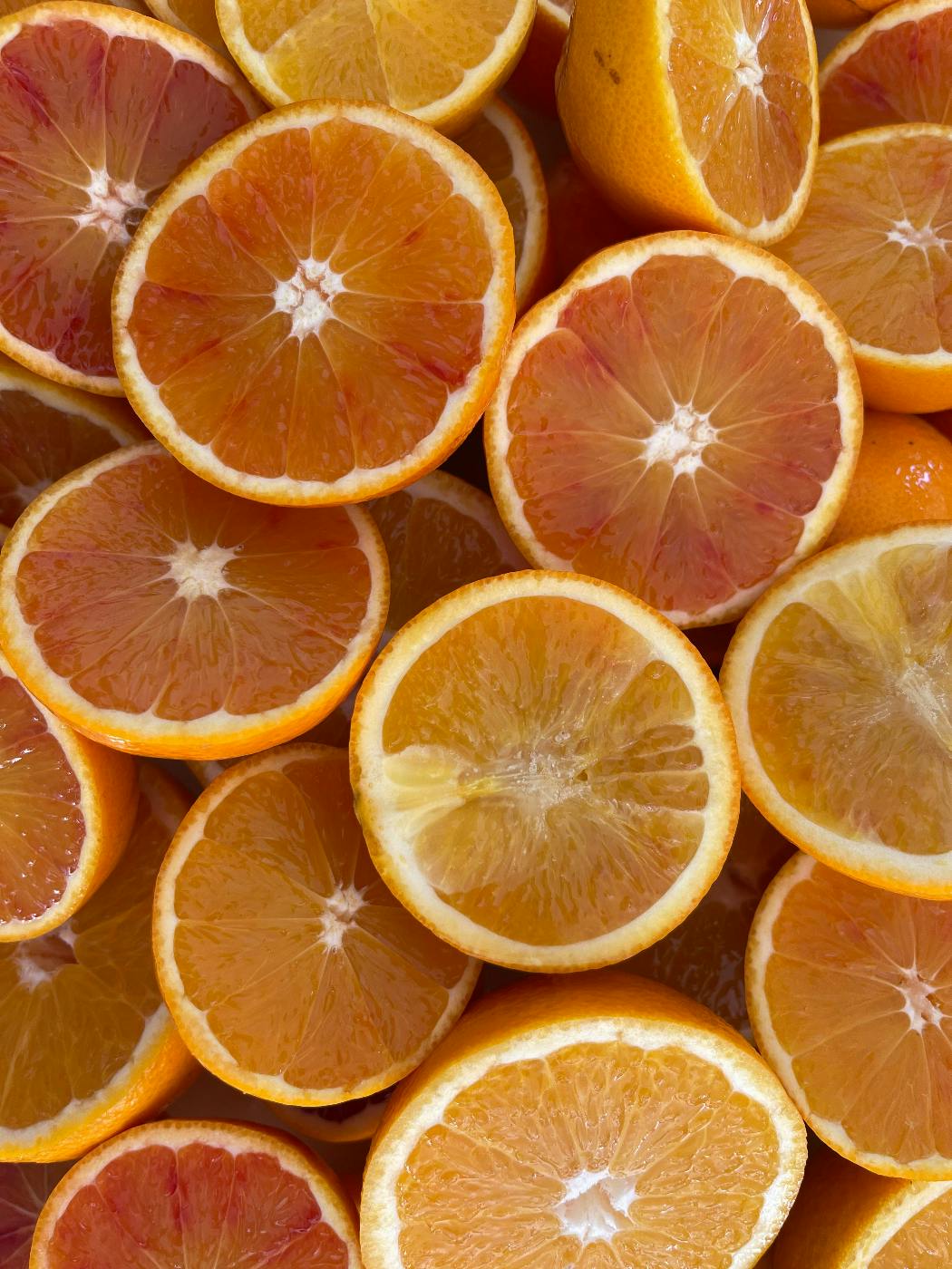 Many halved oranges