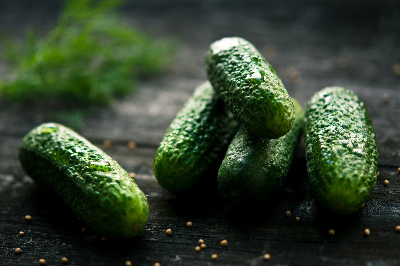 wet pickles on a cutting  board