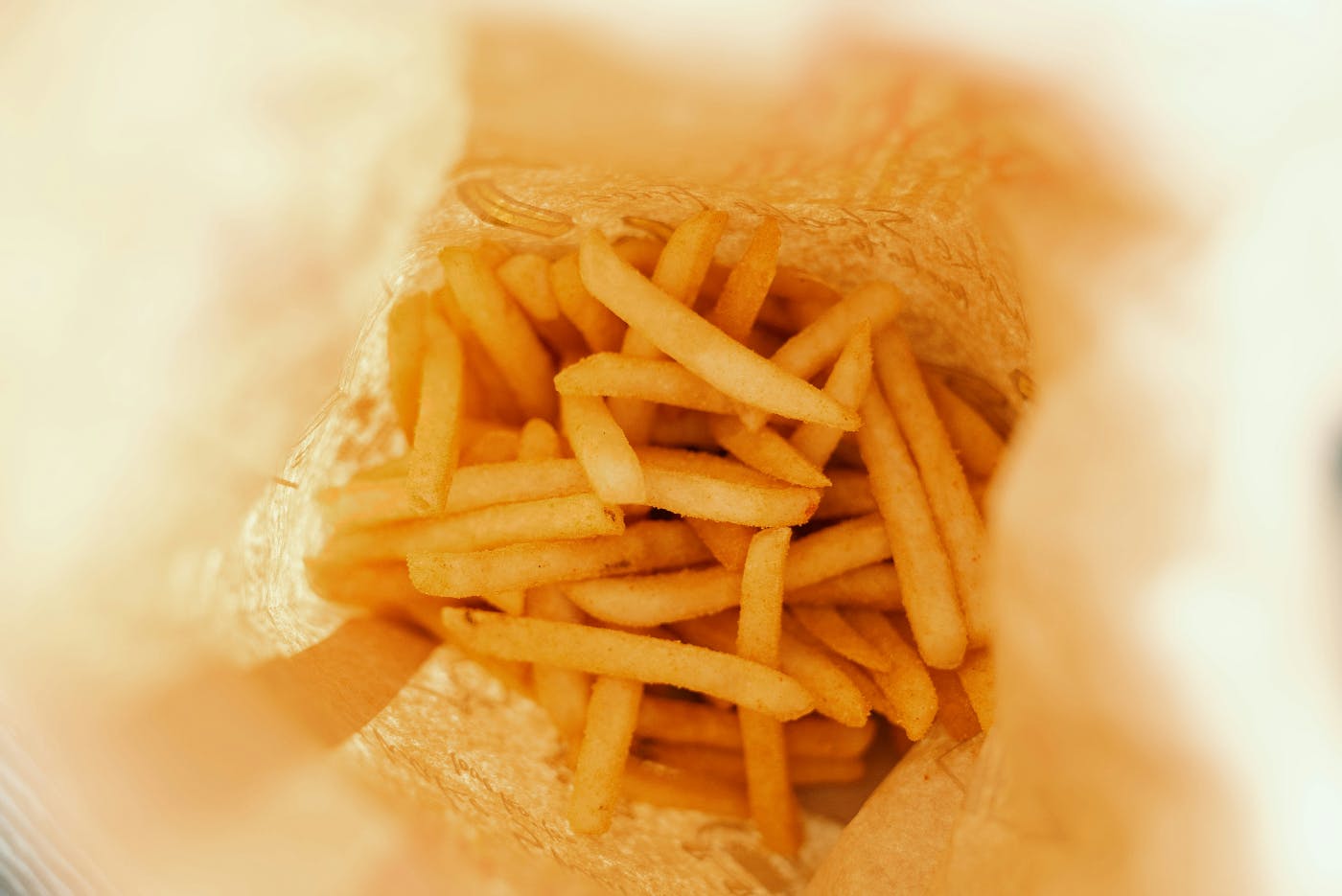 Looking down into a bag of fries