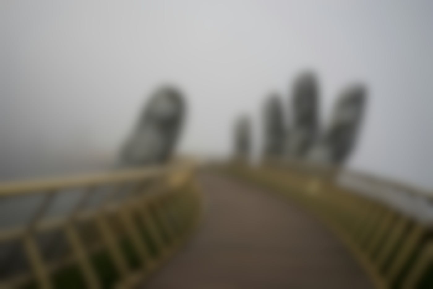 The  curved bridge seemingly supported by a giant hand at the Ba Na Hill Mountain Resorts Da Nang