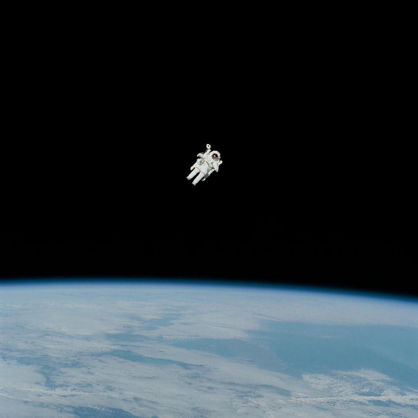 An astronaut floating above the earth