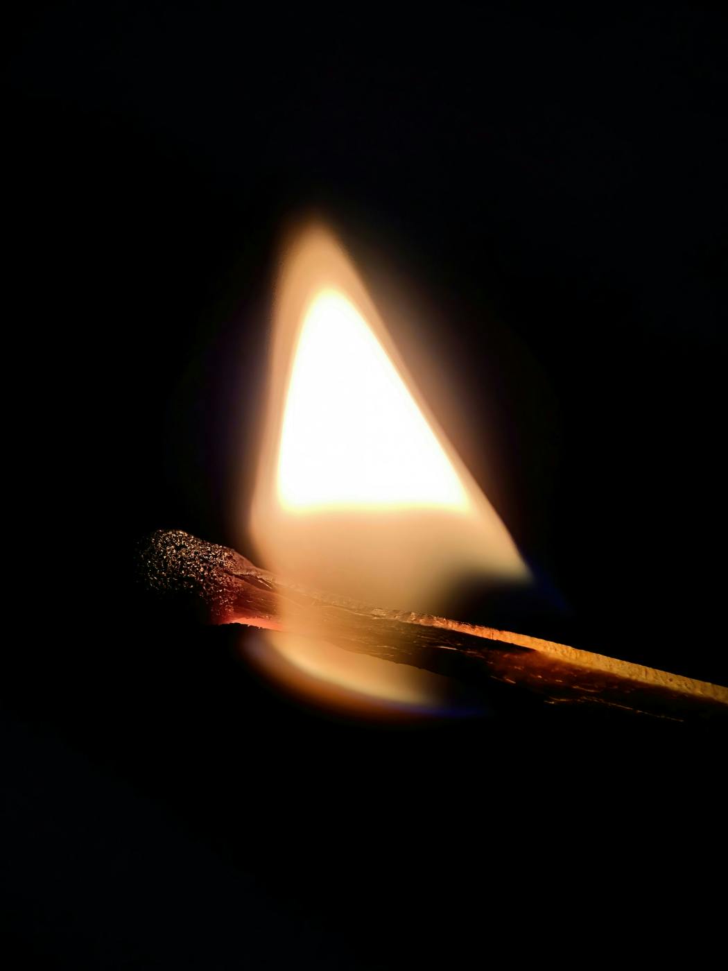 A burning match
