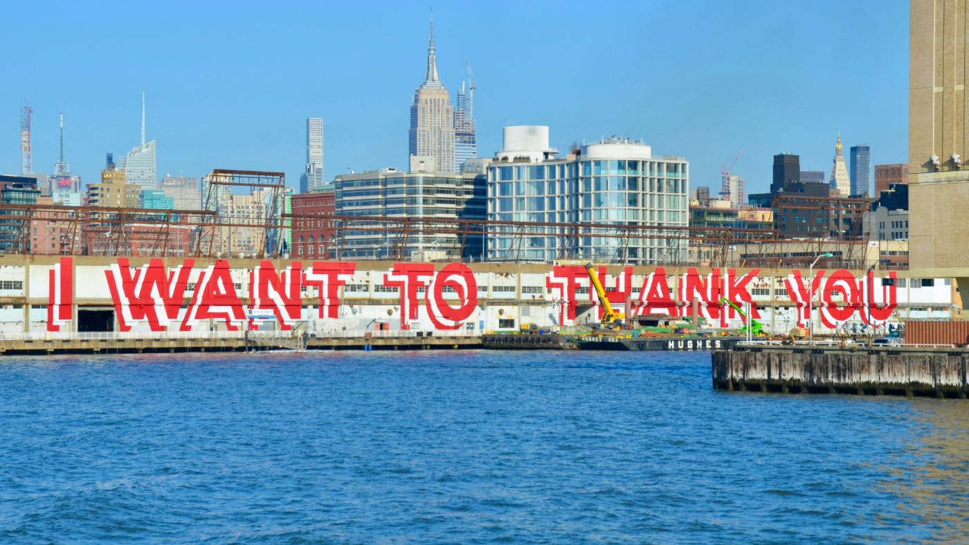 A giant sign across the docks in NYC reading I want to Thank You