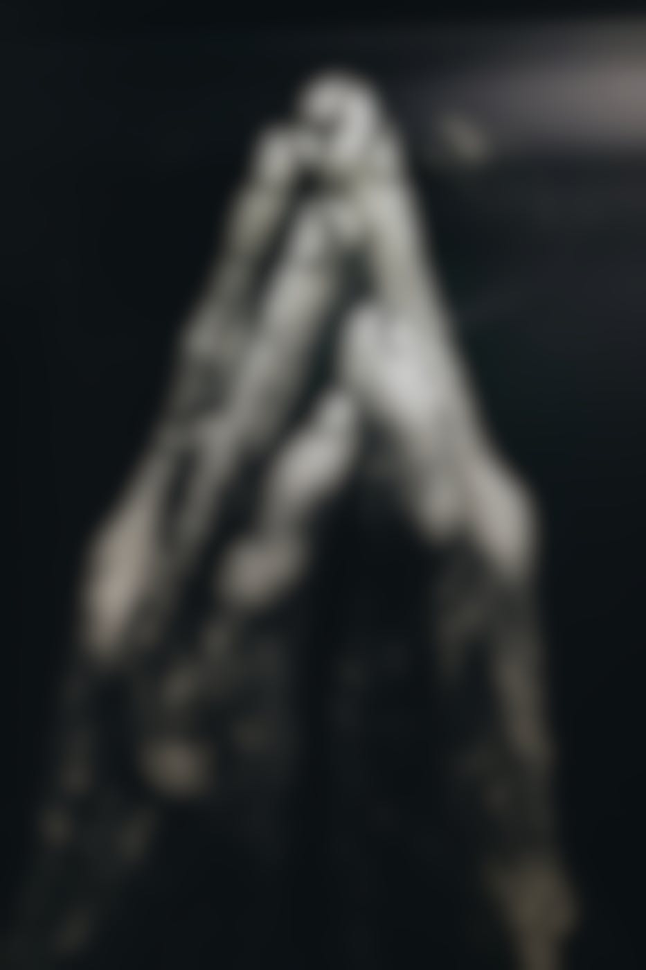 Dusty hands held in prayer