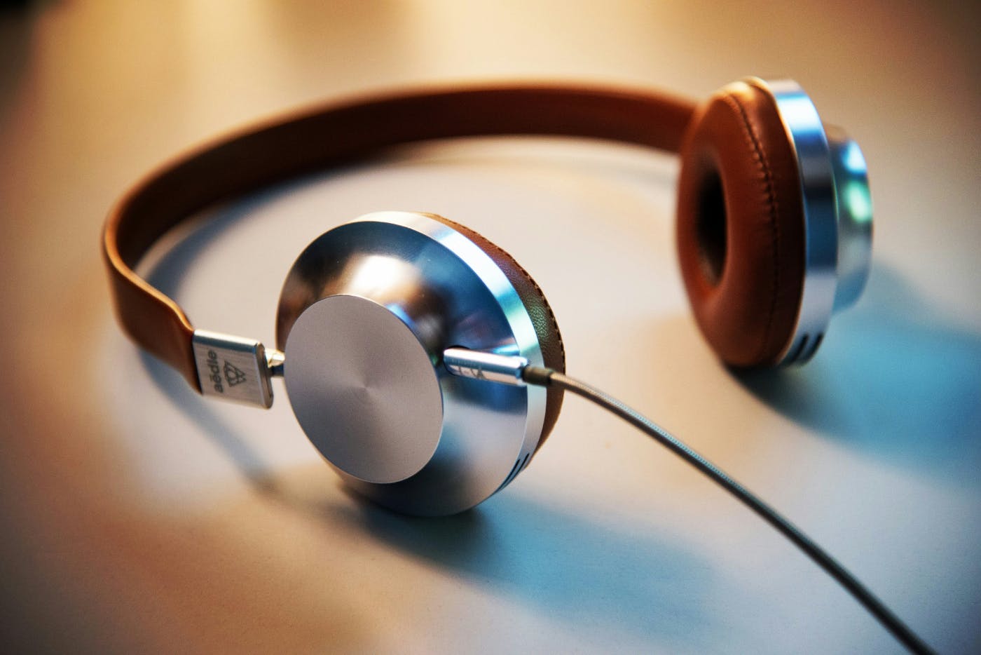 A pair of silver and brown headphones