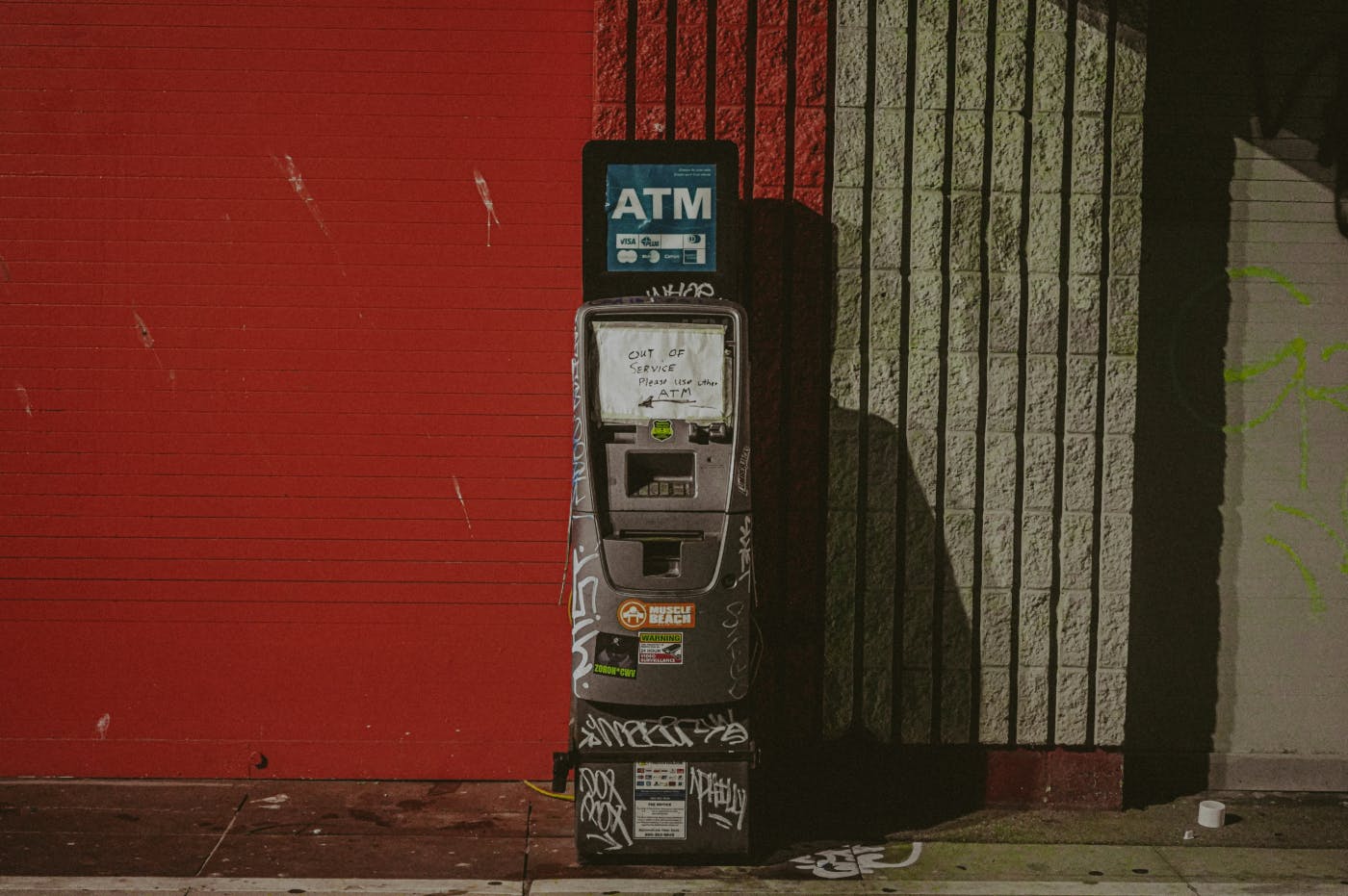 A defaced and broken stand alone ATM