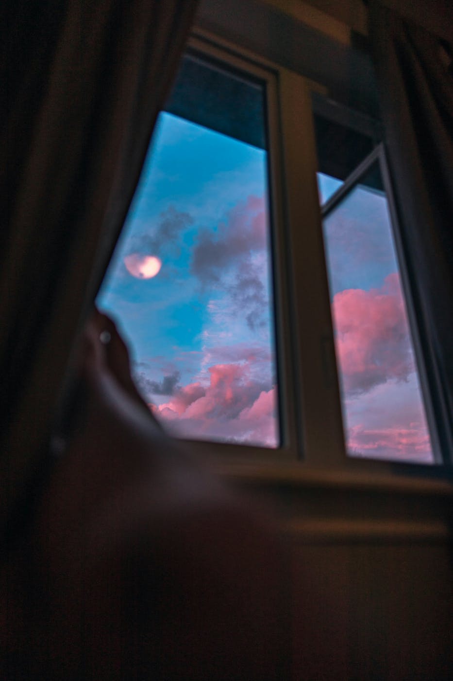 Morning sky with red clouds seen out a window