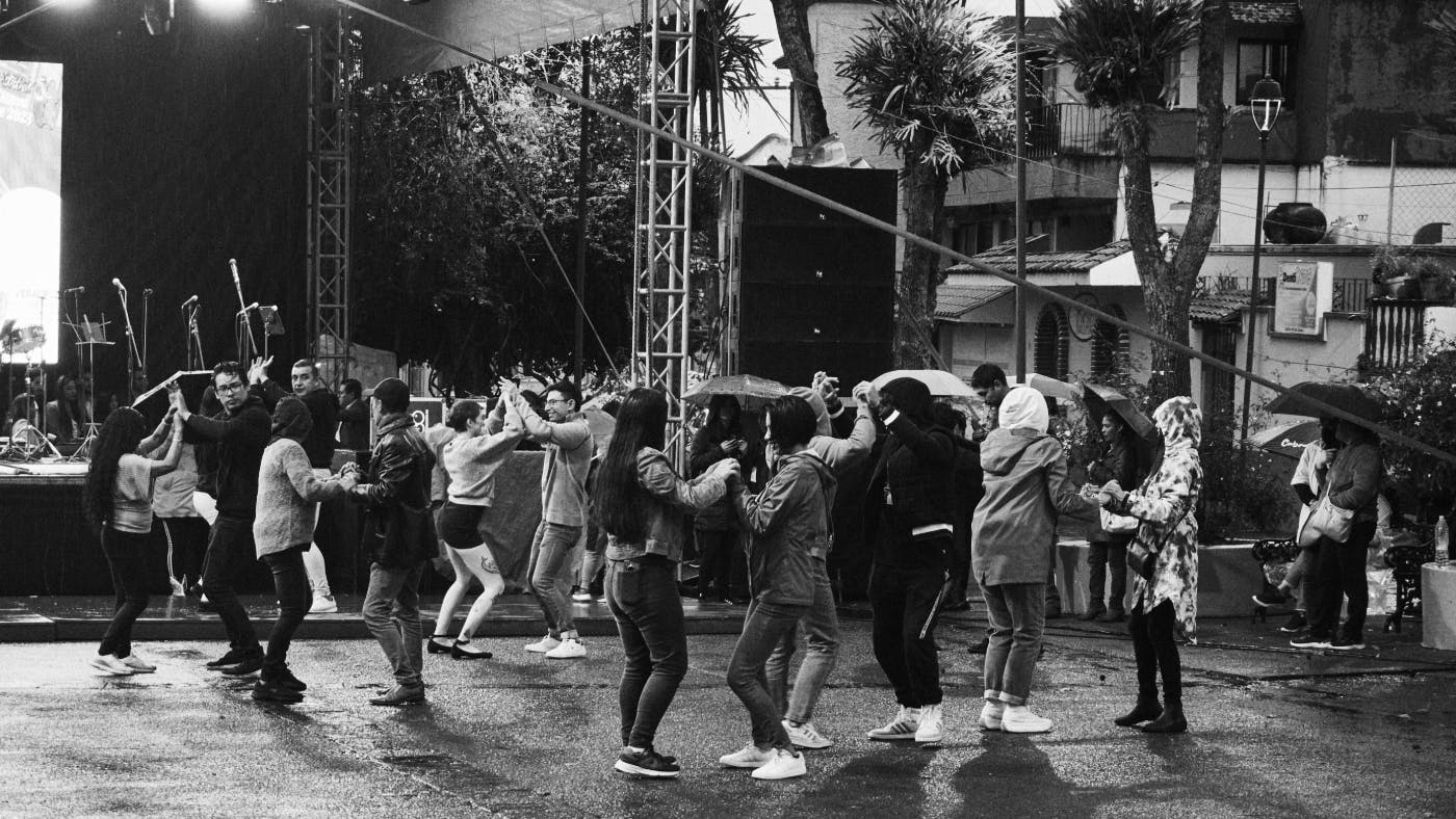 People dancing in the rain