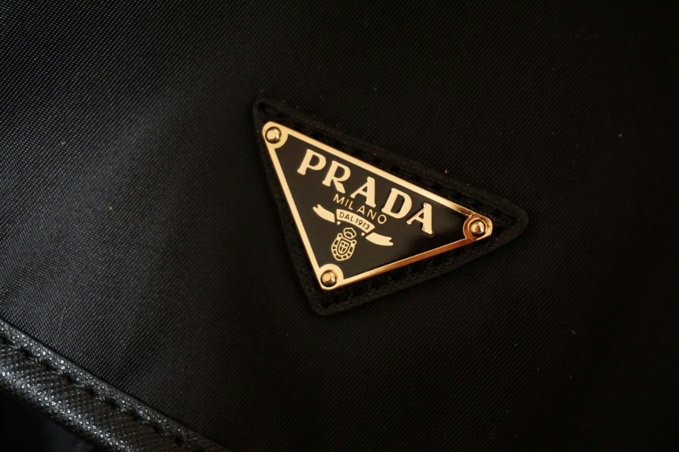 The Prada logo on a black garment