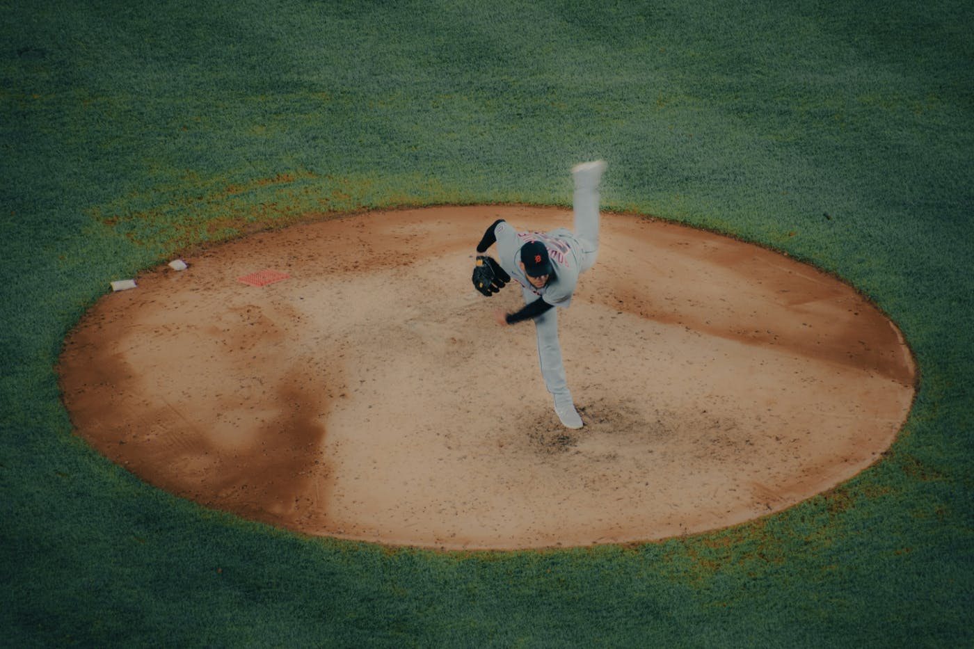 A pitcher in motion on the mound