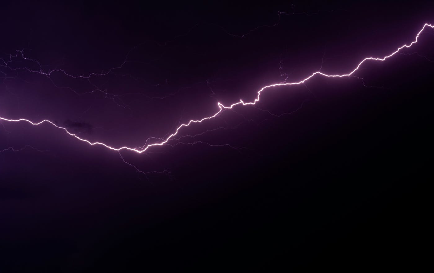 Lightning strike cutting across the night's sky.