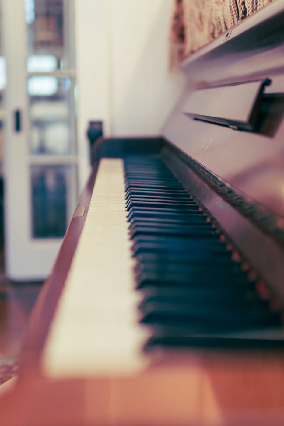 The keyboard of an old upright piano